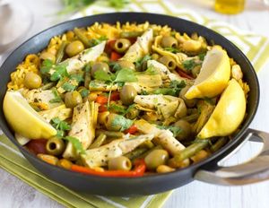 Vegetarian paella with artichokes and oliv